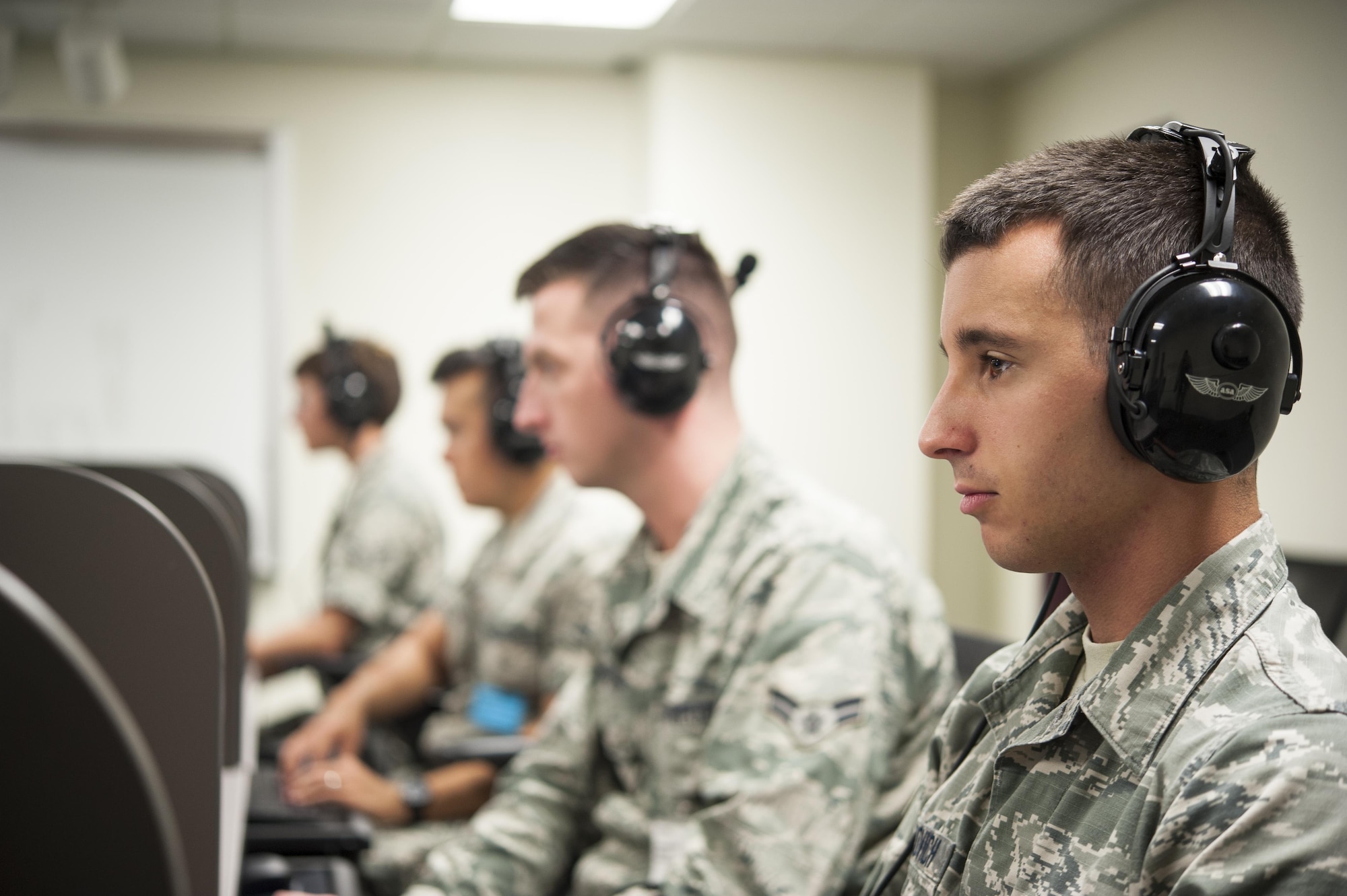 U.S. Air Force Airman 1st Class Joseph F. Crnkovich, 316th Training Squadron, listens to Morse code in class at the 316th TRS on Goodfellow Air Force Base, Texas, Aug. 18, 2015. Previously handled at Fort Huachuca, Arizona, the Morse code course made its way to Goodfellow because the Air Force is the sole DoD component with a standing requirement for Manual Morse training. (U.S. Air Force photo by Staff Sgt. Michael Smith/Released)