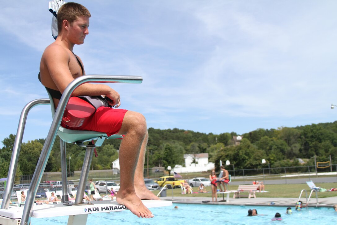 Adam Gordon, 17, a future Marine from Strasburg, Virginia, carefully observes swimmers Aug. 21, 2015, at the Strasburg Town Pool in Strasburg, Virginia. Gordon saved a 16-year old boy from drowning Aug. 15, 2015, while at the pool. He is scheduled to attend recruit training at Marine Corps Recruit Depot Parris Island, South Carolina, July, 2016. (U.S. Marine Corps photo by Sgt. Anthony J. Kirby/Released)