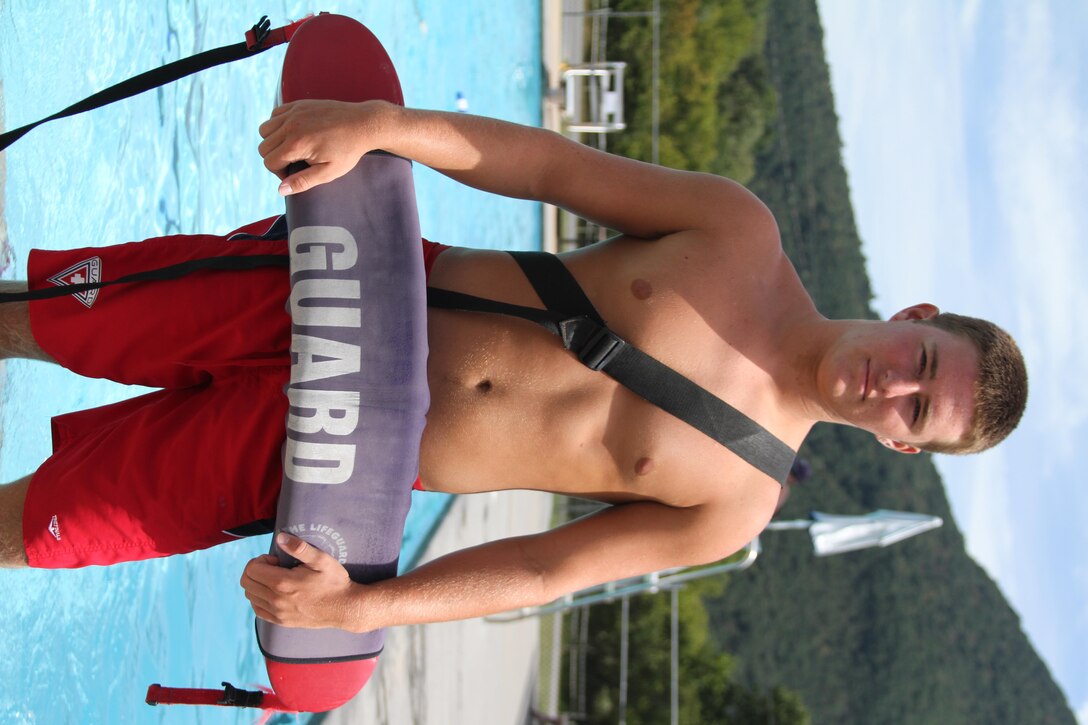 Adam Gordon, 17, a future Marine from Strasburg, Virginia, stands with his lifeguard tube Aug. 21, 2015, at the Strasburg Town Pool in Strasburg, Virginia. Gordon saved a 16-year old boy from drowning Aug. 15, 2015, while at the pool. He is scheduled to attend recruit training at Marine Corps Recruit Depot Parris Island, South Carolina July 2016. (U.S. Marine Corps photo by Sgt. Anthony J. Kirby/Released)