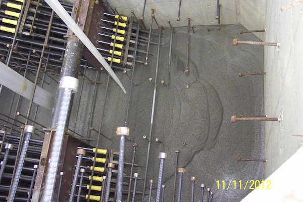 Self-consolidating concrete is poured into a lower pier shell at the Olmsted Dam Construction Project.