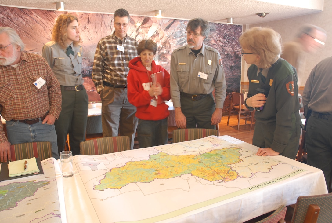 Green River Watershed, Ky., Summit attendees look at a map of the region to examine where sustainable agriculture can improve the area. `