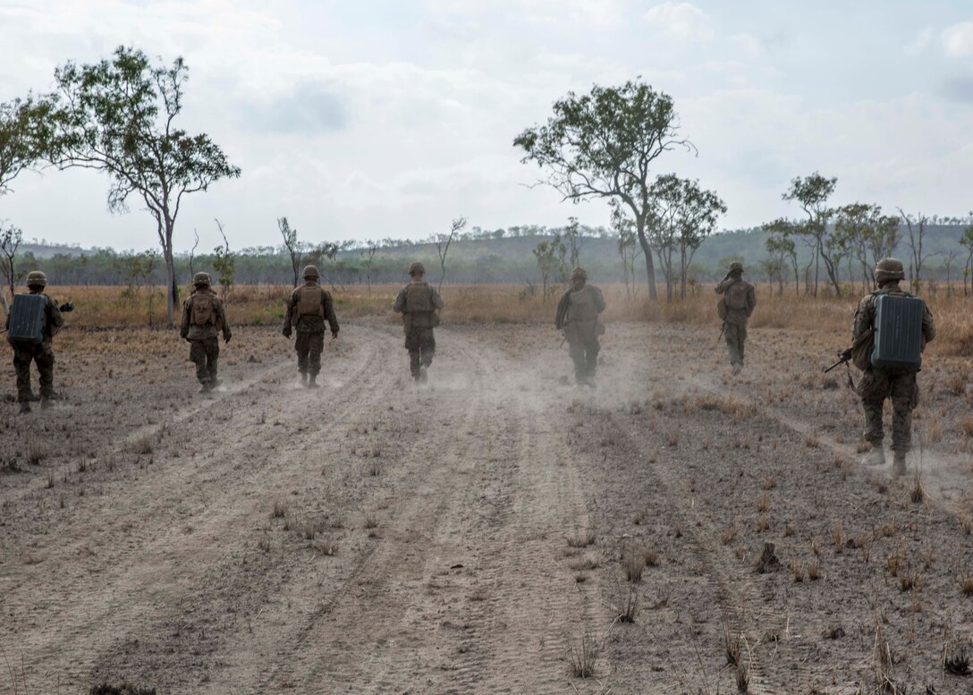 U.S. Marines with 3rd Combat Assault Battalion, Marine Rotational Force – Darwin, conduct a patrol during a demolition training exercise Aug. 21 at Mount Bundey Training Area, Northern Territory, Australia. Combat engineers with MRF-D conducted the demolition to familiarize Marines with tactics, techniques and procedures to safely use the explosives. The rotational deployment in Darwin enables Marines to more effectively train, exercise and operate with their partners, enhancing regional security and building a capacity to respond more rapidly to natural disasters and crises throughout that region. 