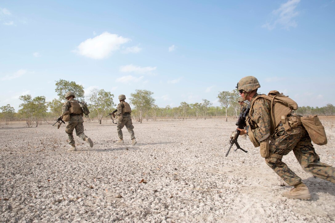 U.S. Marines with 3rd Combat Assault Battalion, Marine Rotational Force – Darwin, set demolition charges during a training exercise Aug. 21 at Mount Bundey Training Area, Northern Territory, Australia. Combat engineers with MRF-D conducted the demolition to familiarize Marines with tactics, techniques and procedures to safely use the explosives. The rotational deployment in Darwin enables Marines to more effectively train, exercise and operate with their partners, enhancing regional security and building a capacity to respond more rapidly to natural disasters and crises throughout that region.