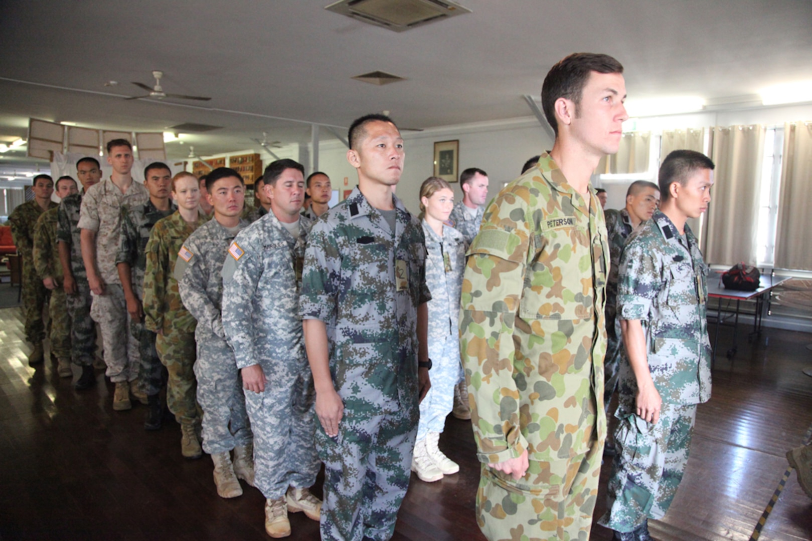 DARWIN, NT, Australia (Aug. 29, 2015) - Participants wait to march out for the opening ceremony Aug. 29 at Larrakeyah Barracks, Darwin, Northern Territory, Australia, before the start of Exercise Kowari 15. Kowari is a trilateral environmental survival training opportunity hosted by Australia and includes forces from Australia, China and the U.S. simultaneously. Environmental survival training in the Australian Outback offers a unique training opportunity in the Pacific. 