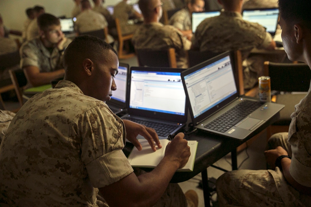 Cpl. Dylan C. Hayslett takes note during a training class about the new Mobile Field System on Camp Kinser, Aug. 4, 2015. The system, which is intended for use by small units and detachments, helps mechanics and technicians when they are not in a satellite location. It tracks all logistics, including the amount of time it takes to perform its functions and which functions are utilized while the system is disconnected. Hayslett, from Hampton, Virginia, is an assault amphibious vehicle technician with Intermediate Maintenance Company, 3rd Maintenance Battalion, Combat Logistics Regiment 35, 3rd Marine Logistics Group, III Marine Expeditionary Force.