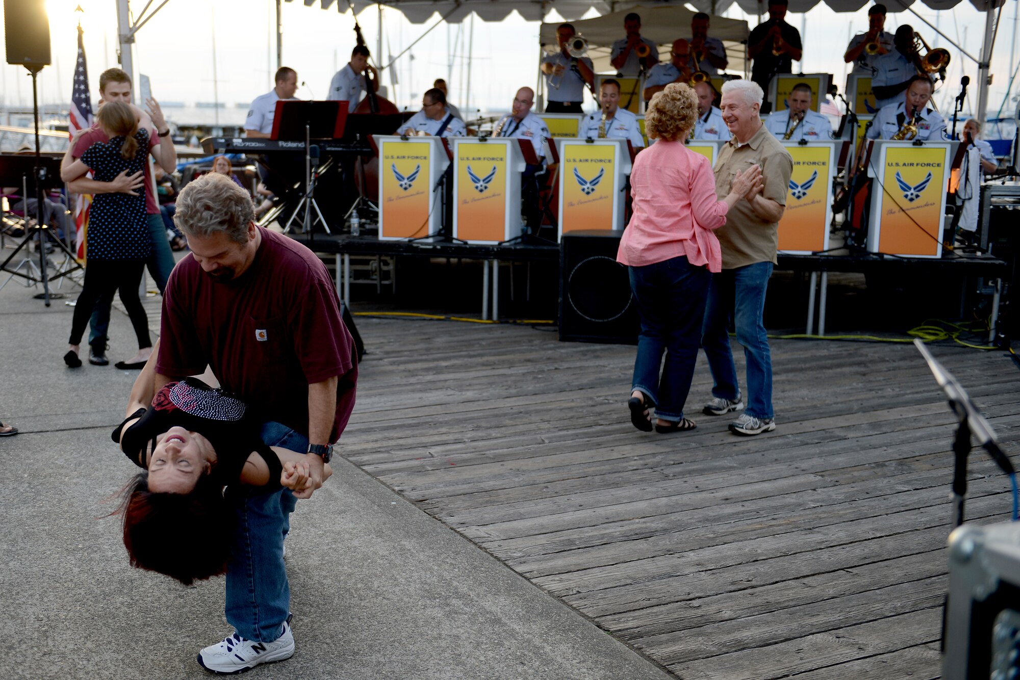 Spectators of the Air Force Band of the Golden West’s jazz ensemble, The Commanders, dance Aug. 27, 2015, at the Everett Marina, Wash. The Commanders performed at five locations in Washington State and Northern Oregon. (U.S. Air Force photo/Airman 1st Class Keoni Chavarria)