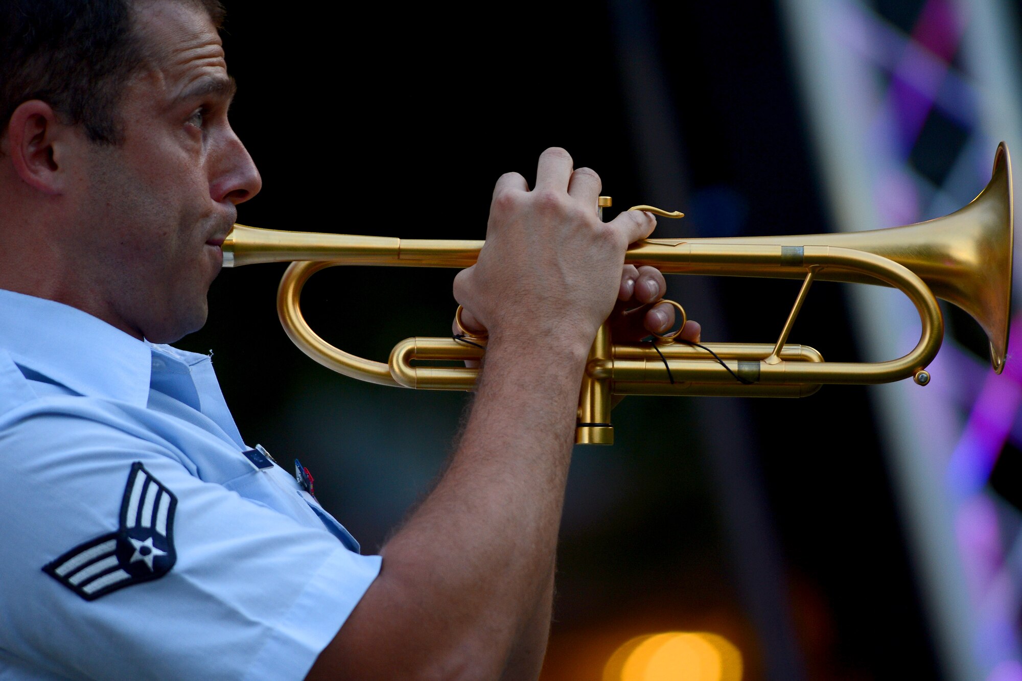Senior Airman Benjamin Paille, Air Force Band of the Golden West trumpet player, performs August 26, 2015, in Olympia, Wash. The Band of the Golden West is the only active duty Air Force band west of the Rocky Mountains and is comprised of 60 Airmen-musicians. (U.S. Air Force photo\ Staff Sgt. Tim Chacon)