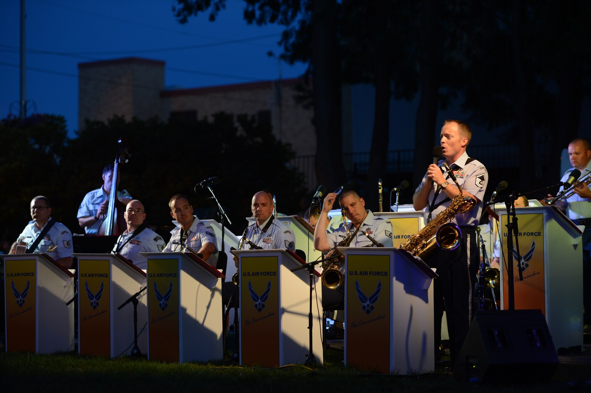 Master Sgt. Jeremiah True (right), Air Force Band of the Golden West’s jazz ensemble, The Commanders, NCO in charge, thanks Olympia residents for their attendance during their show in Sylvester Park, Olympia, Wash., on Aug. 26, 2015. The mission of the Band of the Golden West is to advance Air Mobility Command and global Air Force missions by providing professional musical products and services for official military, recruiting, and community relations events. (U.S. Air Force photo\ Staff Sgt. Katie Jackson)