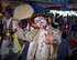 A chondara clown waves to audience members during a Kadena Town Eisa Festival in Kadena Cho, Okinawa, Aug. 29, 2015. The chondara’s primary role during an Eisa celebration is to entertain the crowd and generate excitement. (U.S. Air Force photo by Master Sgt. Jason W. Edwards)