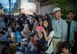 Local community members line the street to watch the performers at a Kadena Town Eisa Festival in Kadena Cho, Japan, Aug. 29, 2015. Eisa festivals are held after Obon, a three-day Okinawan holiday which celebrates life and welcomes the spirits of ancestors home for a family reunion. (U.S. Air Force photo by Master Sgt. Jason W. Edwards)