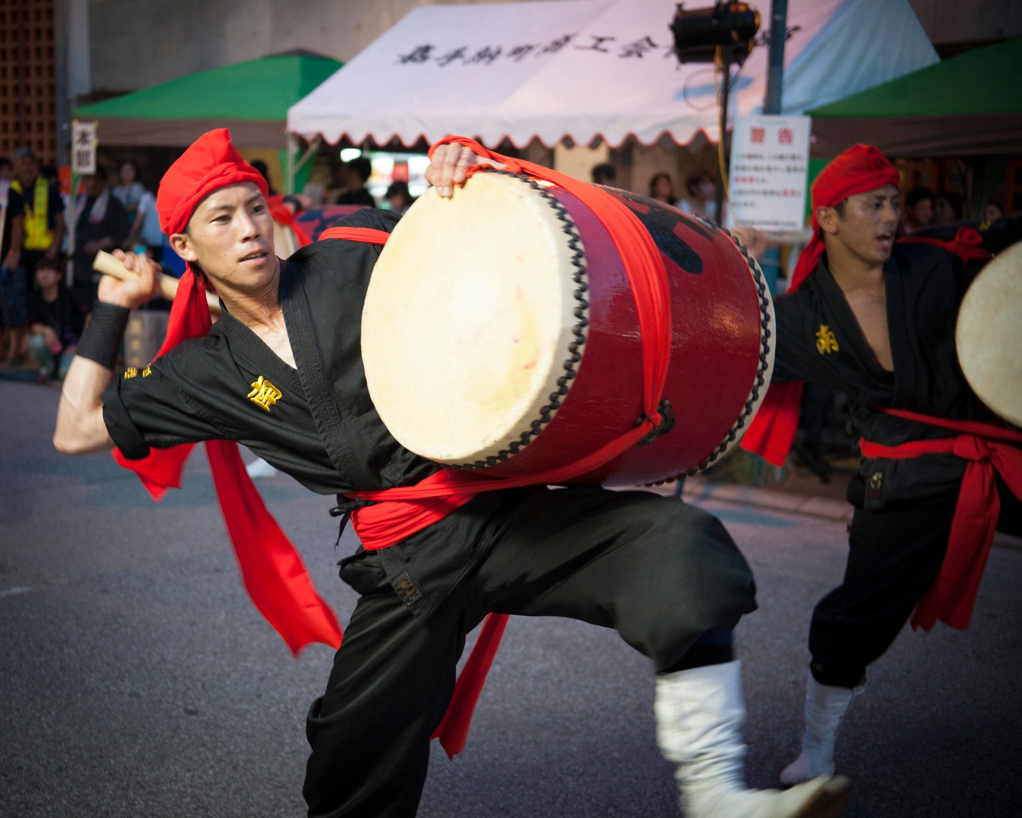 A taiko drummer performs during a Kadena Town Eisa Festival in Kadena Cho, Okinawa, Aug. 29, 2015. Taiko drums have been used in Japanese religious ceremonies and celebrations for more than 2000 years. (U.S. Air Force photo by Master Sgt. Jason W. Edwards)