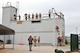 U.S. Air Force Staff Sgt. Jeret Kinnaird, firefighter for the North Carolina Air National Guard, 145th Civil Engineer Squadron, observes from rooftop as military firefighters participate in training for certification including high angle basket raising & lowering and ground ascending, descending & passing a knot at the 145th Civil Engineer Regional Training Site, New London, N.C. Kinnaird, an instructor for ANG Urban Search and Rescue Technician I and II Courses, was presented the “Chief Albert Fitzpatrick Award” for Firefighter of the Year, July 22, 2015. (U.S. Air National Guard photo by Master Sgt. Patricia F. Moran, 145th Public Affairs/Released)