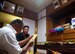 Sousei Yamakawa, owner of the house, prays at the family's butsudan before burning uchikabi, money of the other world, in Yomitan village, Okinawa, Japan, Aug. 28, 2015. Obon is an ancestral memorial event where it is a tradition for descendants and family members to spend time together while the spirits of their ancestors come back to visit their family's home. (U.S. Air Force photo by Naoto Anazawa)