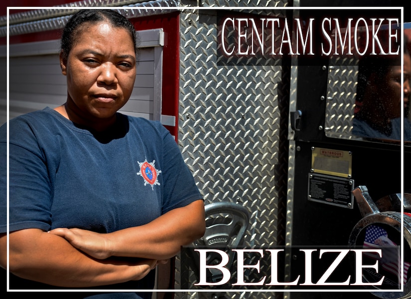 Eldorah Dativa Chacon, a 16-year firefighter veteran from Belize, poses for a photo opportunity during the CENTAM SMOKE exercise Aug. 28, 2015, at Soto Cano Air Base, Honduras. The exercise, known as Central America Sharing Mutual Operational Knowledge and Experience, or "CENTAM SMOKE," brings together U.S. and Central American firefighters to train and improve their ability to work together. (U.S. Air Force illustration by Staff Sgt. Jessica Condit)