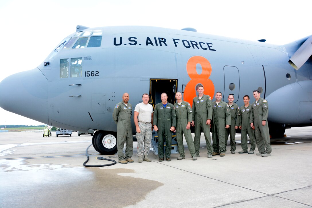 U.S. Air Force Col. Charles D. Davis III, poses with fellow aircrew members and maintenance personnel next to the 145th Airlift Wing, C-130 Hercules aircraft after landing and completing his final flight at the North Carolina Air National Guard Base, Charlotte Douglas International Airport, July 28, 2015. In a tradition nearly as old as military aviation itself, this “fini” flight symbolizes the end of Davis’ 38 years of honorable military service. (U.S. Air National Guard photo by Master Sgt. Patricia F. Moran, 145th Public Affairs/Released)