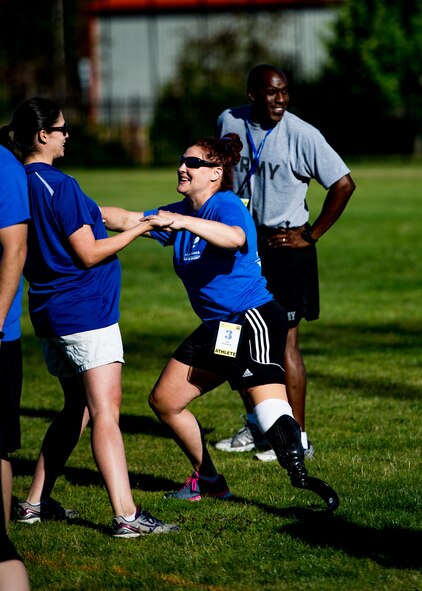 A Wounded Warrior stretches prior to participating in track and field training during the Air Force Wounded Warrior Program Warrior Care event, Aug. 26, 2015 at Joint Base Lewis-McChord, Wash. The Warrior Care event featured adaptive and rehabilitative sports, activities, career readiness, recovering Airman mentorship and caregiver training. It was an opportunity for all wounded, ill and injured service members to engage in friendly competition. Wounded Warriors from JBLM and veterans from the northwest region were all invited to participate in the camp. (U.S. Air Force Reserve photo by Senior Airman Daniel Liddicoet/Released)