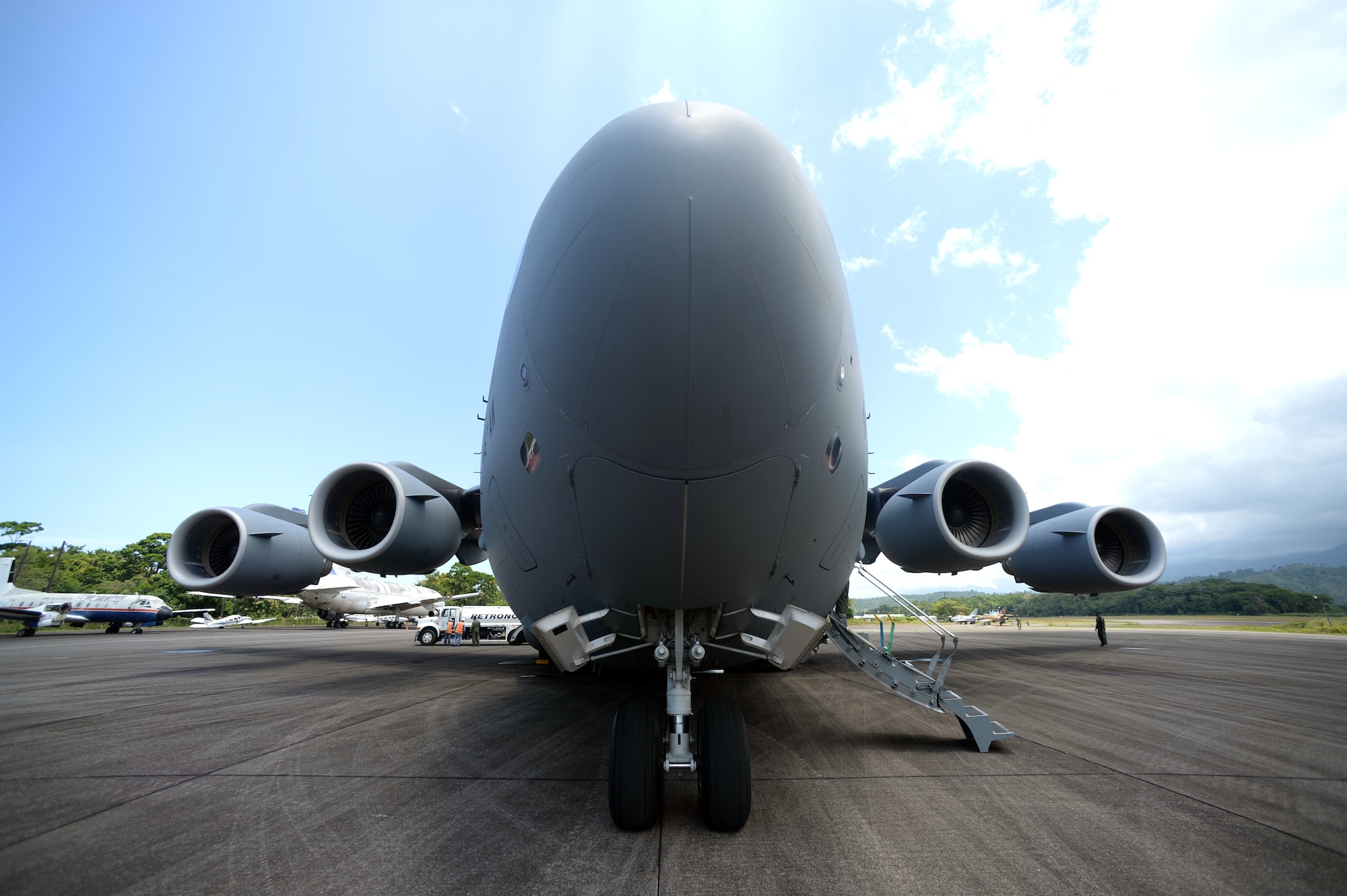 New Horizons Honduras 2015 training exercise personnel depart Base Aerea Coronel Hector Caraccioli Moncada in La Ceiba, Honduras, Aug. 28, 2015, on a C-17 Globemaster III from the 62nd Airlift Wing out of Joint Base Lewis-McChord, Wash., for Hurlburt Field, Fla. Vehicles, equipment and personnel from New Horizons redeployed to Hurlburt Field while the few remaining exercise members will coordinate the sealift of all other equipment. New Horizons was launched in the 1980s and is an annual joint humanitarian assistance exercise that U.S. Southern Command conducts with a partner nation in Central America, South America or the Caribbean. The exercise improves joint training readiness of U.S. and partner nation civil engineers, medical professionals and support personnel through humanitarian assistance activities. (U.S. Air Force photo by Capt. David J. Murphy/Released)