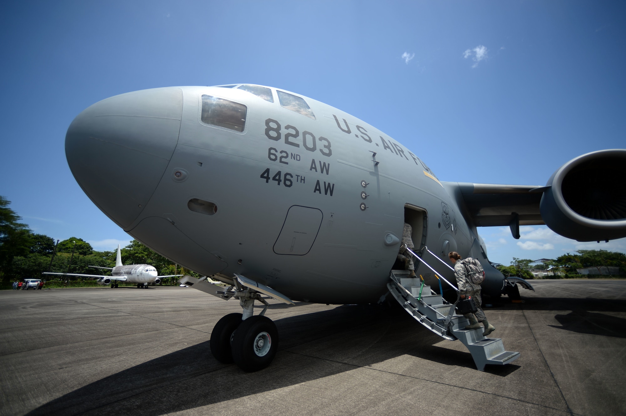 New Horizons Honduras 2015 training exercise personnel board a waiting C-17 Globemaster III from the 62nd Airlift Wing out of Joint Base Lewis-McChord, Wash., at Base Aerea Coronel Hector Caraccioli Moncada in La Ceiba, Honduras, Aug. 28, 2015, on its way to Hurlburt Field, Fla. Vehicles, equipment and personnel from New Horizons redeployed to Hurlburt Field while remaining exercise members will coordinate the sealift of all other equipment. New Horizons was launched in the 1980s and is an annual joint humanitarian assistance exercise that U.S. Southern Command conducts with a partner nation in Central America, South America or the Caribbean. The exercise improves joint training readiness of U.S. and partner nation civil engineers, medical professionals and support personnel through humanitarian assistance activities. (U.S. Air Force photo by Capt. David J. Murphy/Released)