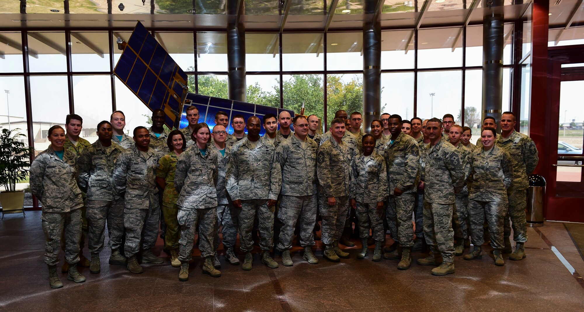 Chief Master Sgt. Patrick McMahon, Air Force Space Command command chief, middle, is briefed by members of the Base Defense Operations Center Aug. 28, 2015 at the security forces building on Buckley Air Force Base, Colo. McMahon visited Buckley AFB for the first time after becoming the senior enlisted leader of Air Force Space Command, communicating his goals, answering Airman’s questions and recognizing outstanding performers. (U.S. Air Force photo by Senior Airman Phillip Houk/Released)