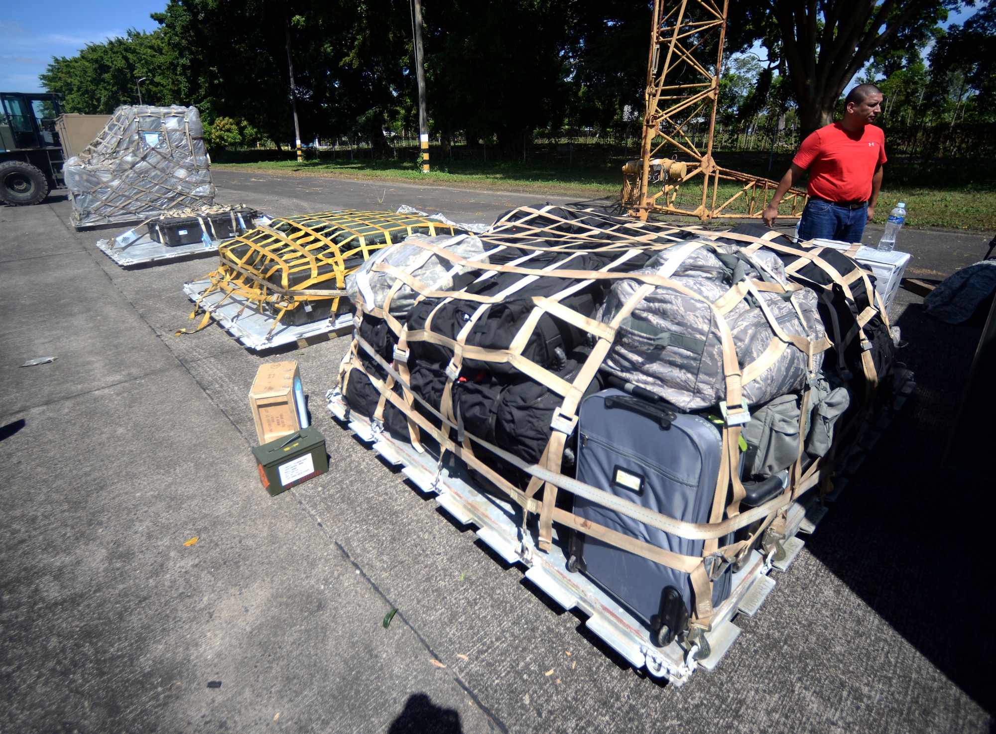 Pallets sit on the tarmac in Base Aerea Coronel Hector Caraccioli Moncada in La Ceiba, Honduras, ready to be loaded onto a C-17 Globemaster III from the 62nd Airlift Wing out of Joint Base Lewis-McChord, Wash., Aug. 28, 2015. The pallets contain personal gear and equipment used during the New Horizons Honduras 2015 training exercise and was headed back to Hurlburt Field, Fla. New Horizons was launched in the 1980s and is an annual joint humanitarian assistance exercise that U.S. Southern Command conducts with a partner nation in Central America, South America or the Caribbean. The exercise improves joint training readiness of U.S. and partner nation civil engineers, medical professionals and support personnel through humanitarian assistance activities. (U.S. Air Force photo by Capt. David J. Murphy/Released)