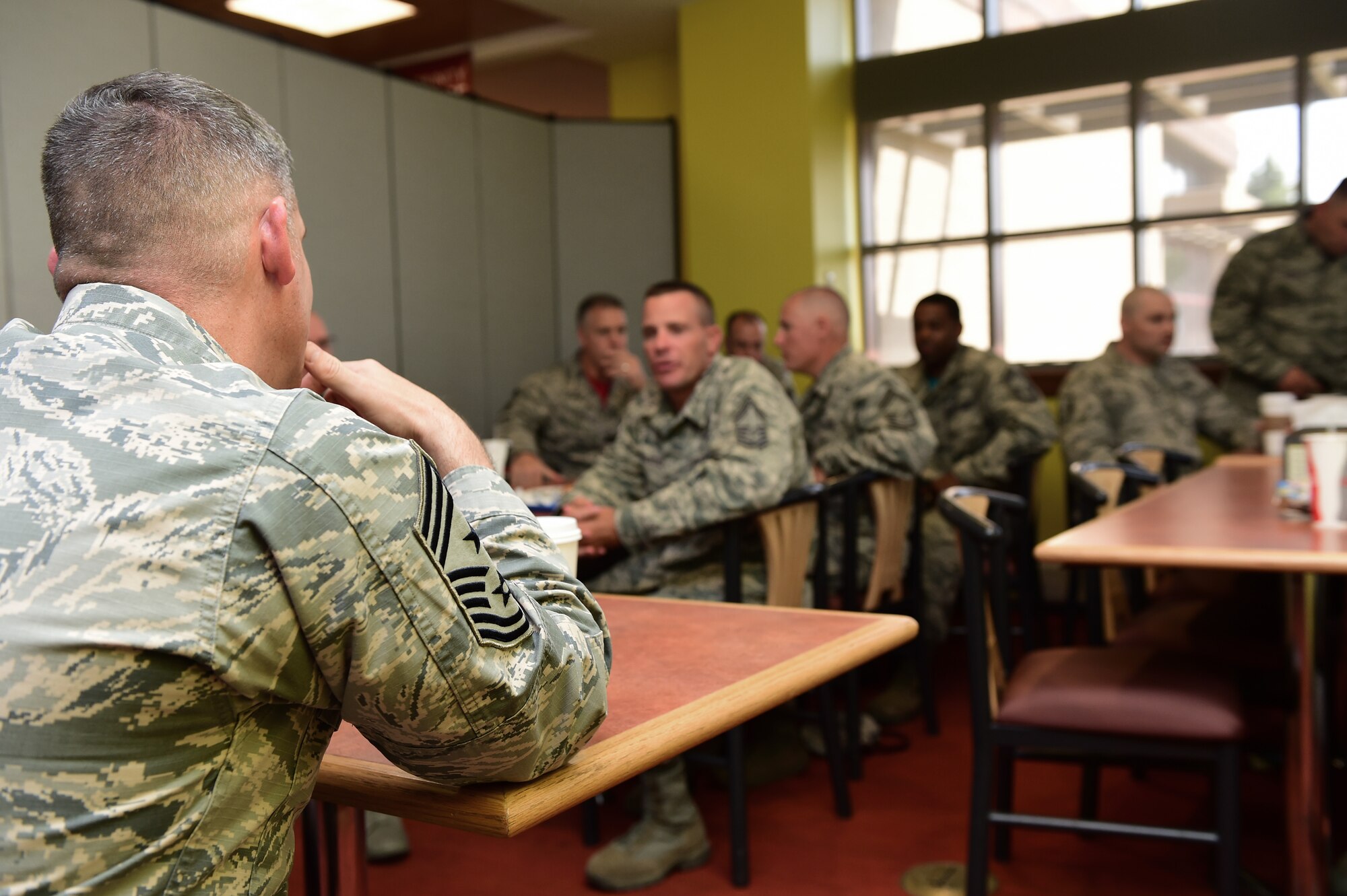 Buckley enlisted leaders ask Chief Master Sgt. Patrick McMahon, Air Force Space Command command chief, questions during lunch Aug. 28, 2015, at the Panthers Den on Buckley Air Force Base, Colo. McMahon visited Buckley AFB for the first time after becoming the senior enlisted leader of Air Force Space Command, communicating his goals, answering Airman’s questions and recognizing outstanding performers. (U.S. Air Force photo by Senior Airman Phillip Houk/Released)