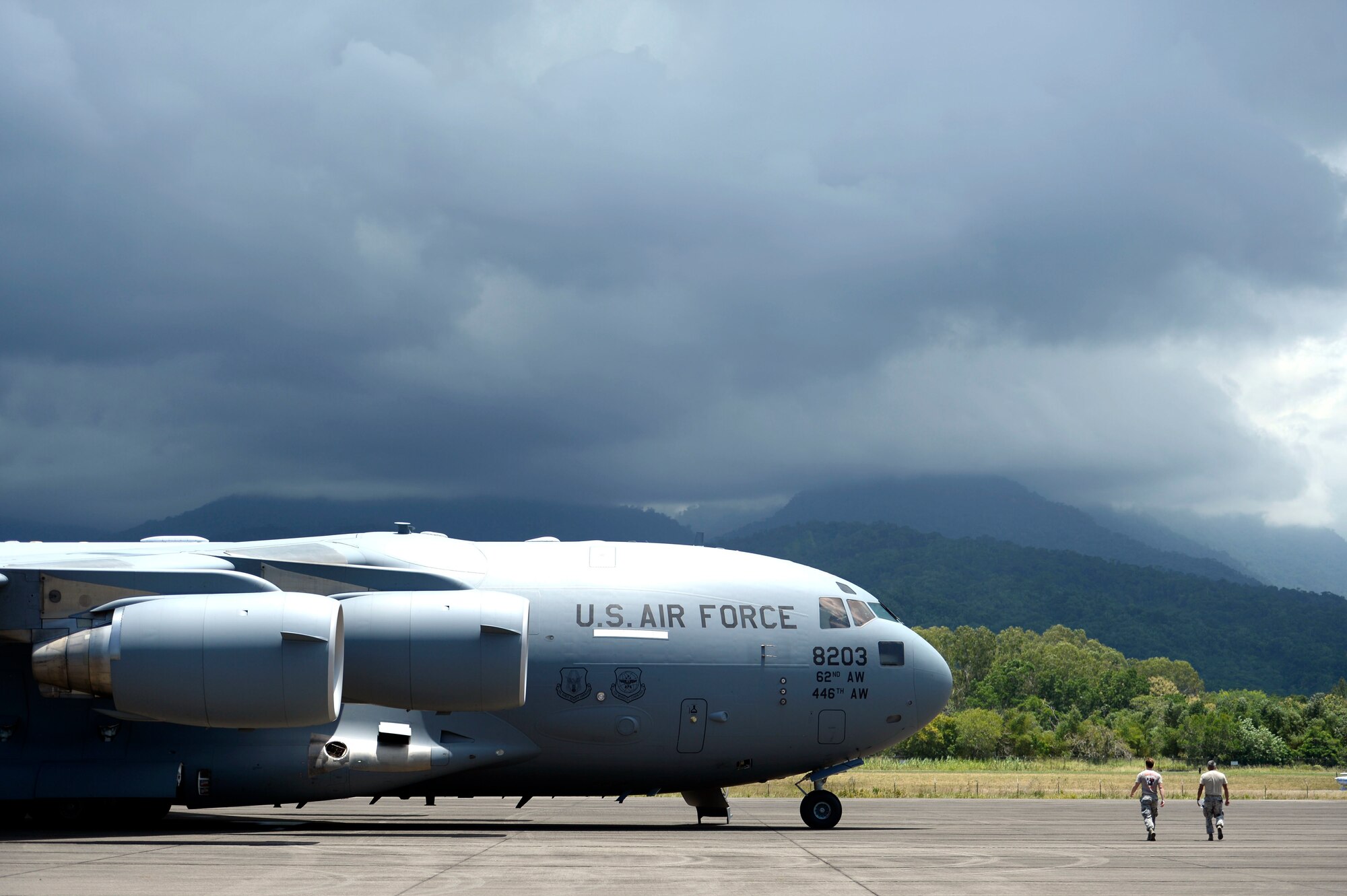 New Horizons Honduras 2015 training exercise personnel approach a waiting C-17 Globemaster III from the 62nd Airlift Wing out of Joint Base Lewis-McChord, Wash., Base Aerea Coronel Hector Caraccioli Moncada in La Ceiba, Honduras, Aug. 28, 2015, on its way to Hurlburt Field, Fla. Vehicles, equipment and personnel from New Horizons redeployed to Hurlburt Field while remaining equipment will be transported via sealift. New Horizons was launched in the 1980s and is an annual joint humanitarian assistance exercise that U.S. Southern Command conducts with a partner nation in Central America, South America or the Caribbean. The exercise improves joint training readiness of U.S. and partner nation civil engineers, medical professionals and support personnel through humanitarian assistance activities. (U.S. Air Force photo by Capt. David J. Murphy/Released)