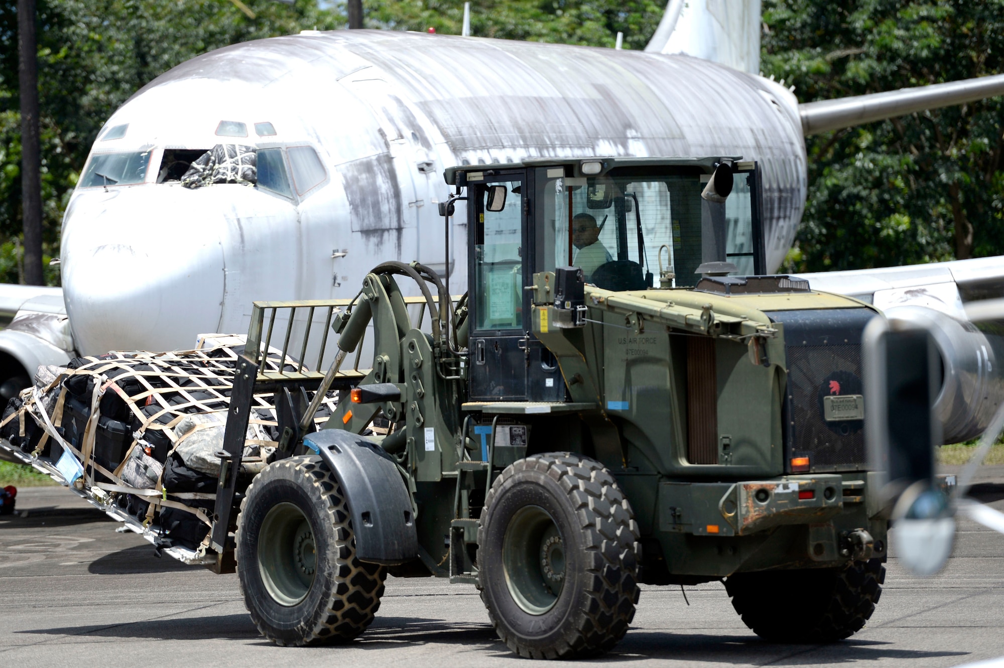 U.S. Air Force Staff Sgt. Raul Perez, 823rd Expeditionary RED HORSE Squadron vehicle maintenance NCOIC, out of Hurlburt Field, Fla., moves a pallet with a forklift at Base Aerea Coronel Hector Caraccioli Moncada in La Ceiba, Honduras, Aug. 28, 2015, to a waiting C-17 Globemaster III from the 62nd Airlift Wing out of Joint Base Lewis-McChord, Wash. Vehicles, equipment and personnel from the New Horizons Honduras 2015 training exercise redeployed to Hurlburt Field. All remaining equipment will be transported via sealift. New Horizons was launched in the 1980s and is an annual joint humanitarian assistance exercise that U.S. Southern Command conducts with a partner nation in Central America, South America or the Caribbean. The exercise improves joint training readiness of U.S. and partner nation civil engineers, medical professionals and support personnel through humanitarian assistance activities. (U.S. Air Force photo by Capt. David J. Murphy/Released)