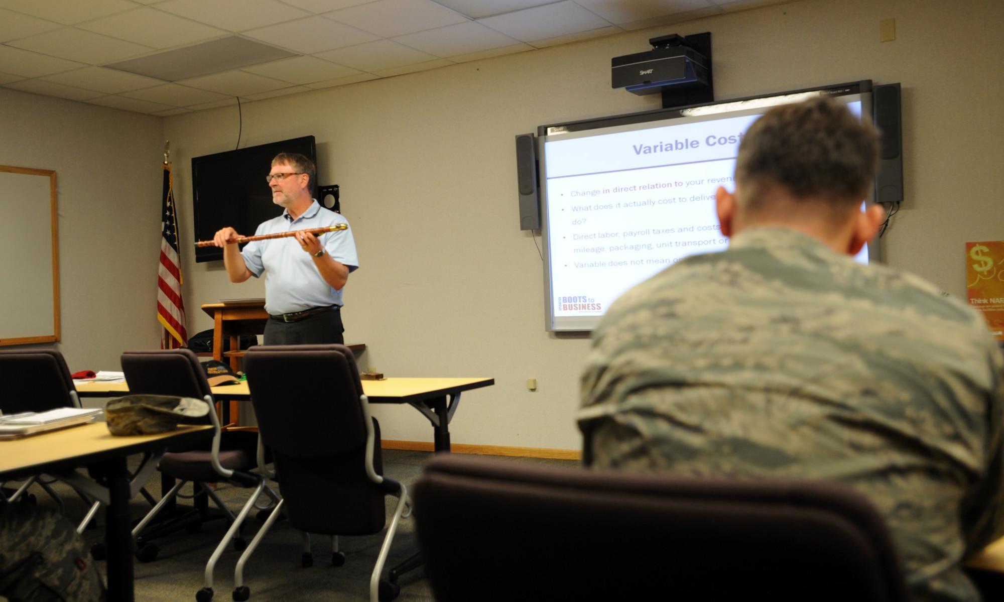 Eric Giltner, U.S. Small Business Administration senior area manager, discusses variable costs during a Boots to Business class at the Airman & Family Readiness Center at Grand Forks Air Force Base, North Dakota, Aug. 18, 2015. Boots to Business is a two-day exploratory class offered to military members, and their families, whom are interested in opening their own business. (U.S. Air Force photo by Senior Airman Desiree Economides/Released)