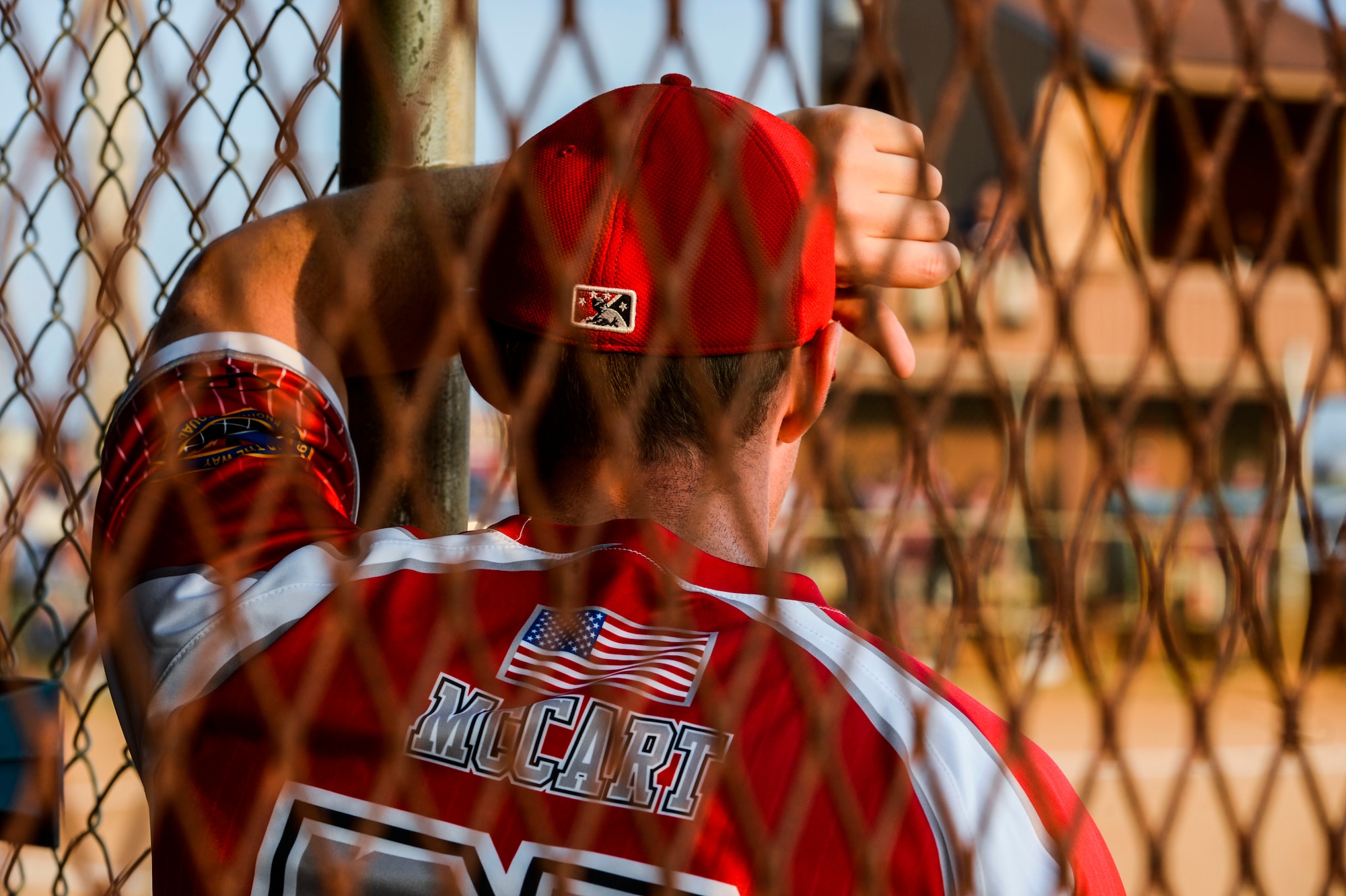 U.S. Air Force Corey McCart, 633rd Civil Engineer Squadron team member, cheers on his teammates from the dugout during the 2015 Intramural Softball Championship at Langley Air Force Base, Va., Aug. 25, 2015. After leading for most of the game, the 633rd CES failed to defend their championship title, as the 45th Intelligence Squadron came back and won. (U.S. Air Force photo by Senior Airman Kayla Newman/Released)