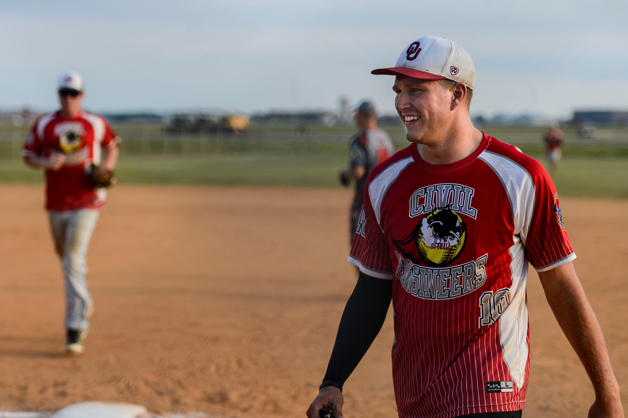 U.S. Air Force Airman 1st Class Corey Reeves, 633rd Civil Engineer Squadron softball team member, walks to the dugout following an inning during the 2015 Intramural Softball Championship at Langley Air Force Base, Va., Aug. 25, 2015. The 633rd CES were the defending intramural softball champions and held a record of eight wins and two losses during the regular season. (U.S. Air Force photo by Senior Airman Kayla Newman/Released)