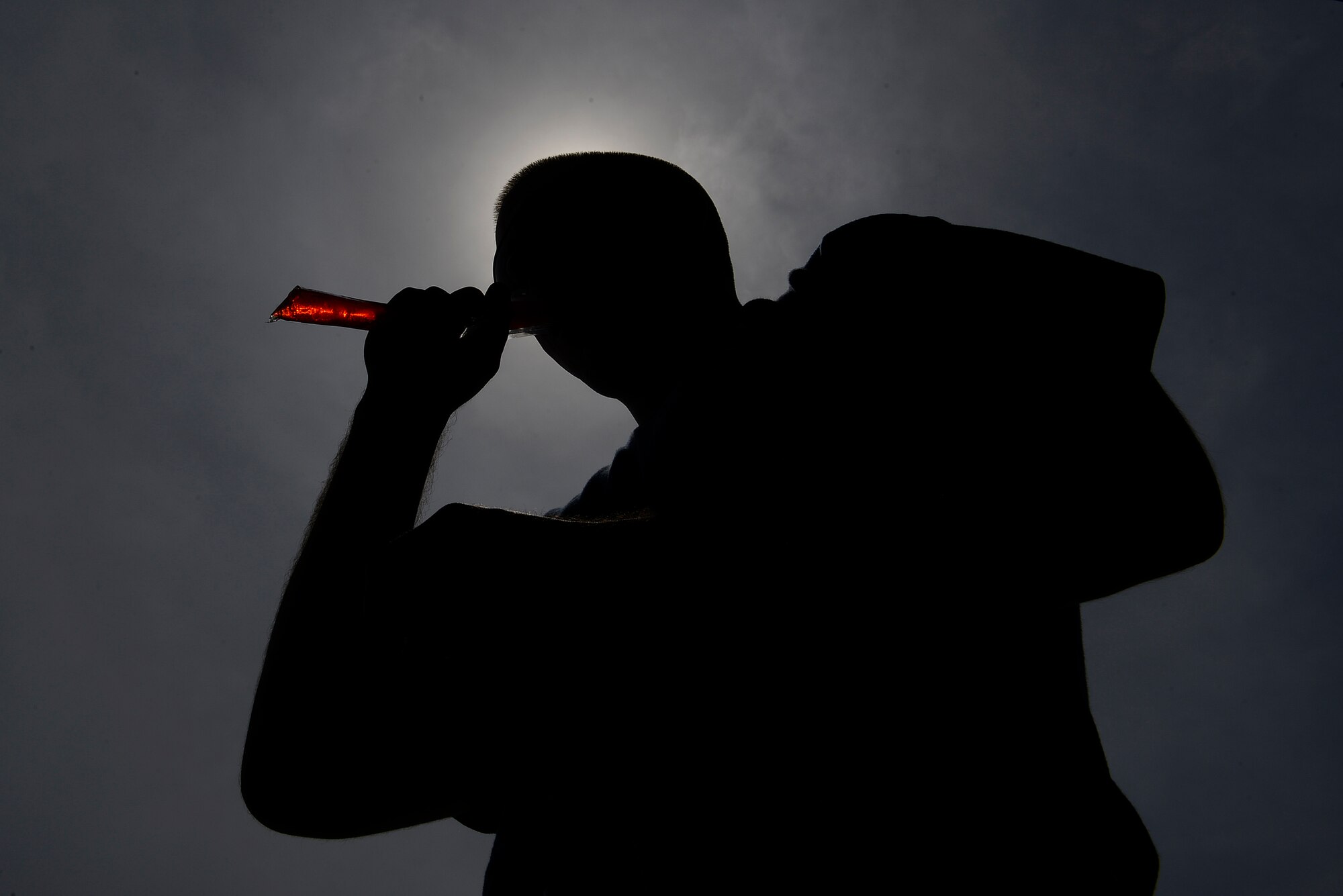U.S. Air Force Senior Airman Trenton Mauck, 20th Aircraft Maintenance Squadron, 55th Aircraft Maintenance Unit aircraft maintainer, eats an ice pop provided by Shaw Top 3 members during a mentorship event at Shaw Air Force Base, S.C., Aug. 28, 2015. The event gave Airmen the opportunity to take a break from their duties while receiving mentorship from senior NCOs. (U.S. Air Force photo by Airman 1st Class Christopher Maldonado/Released)