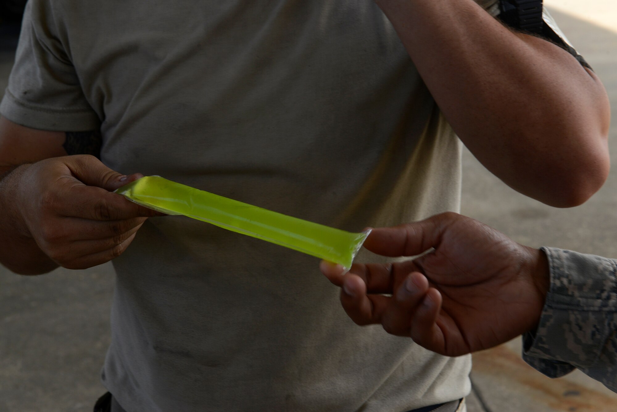 Shaw Top 3 members went to the flightline and back shops to pass out water and ice pops, while providing mentorship to maintenance personnel at Air Force Base, S.C., Aug. 28, 2015. During their time on the flightline they spoke with the maintenance Airmen about their work environment and mission. (U.S. Air Force photo by Airman 1st Class Christopher Maldonado/Released)