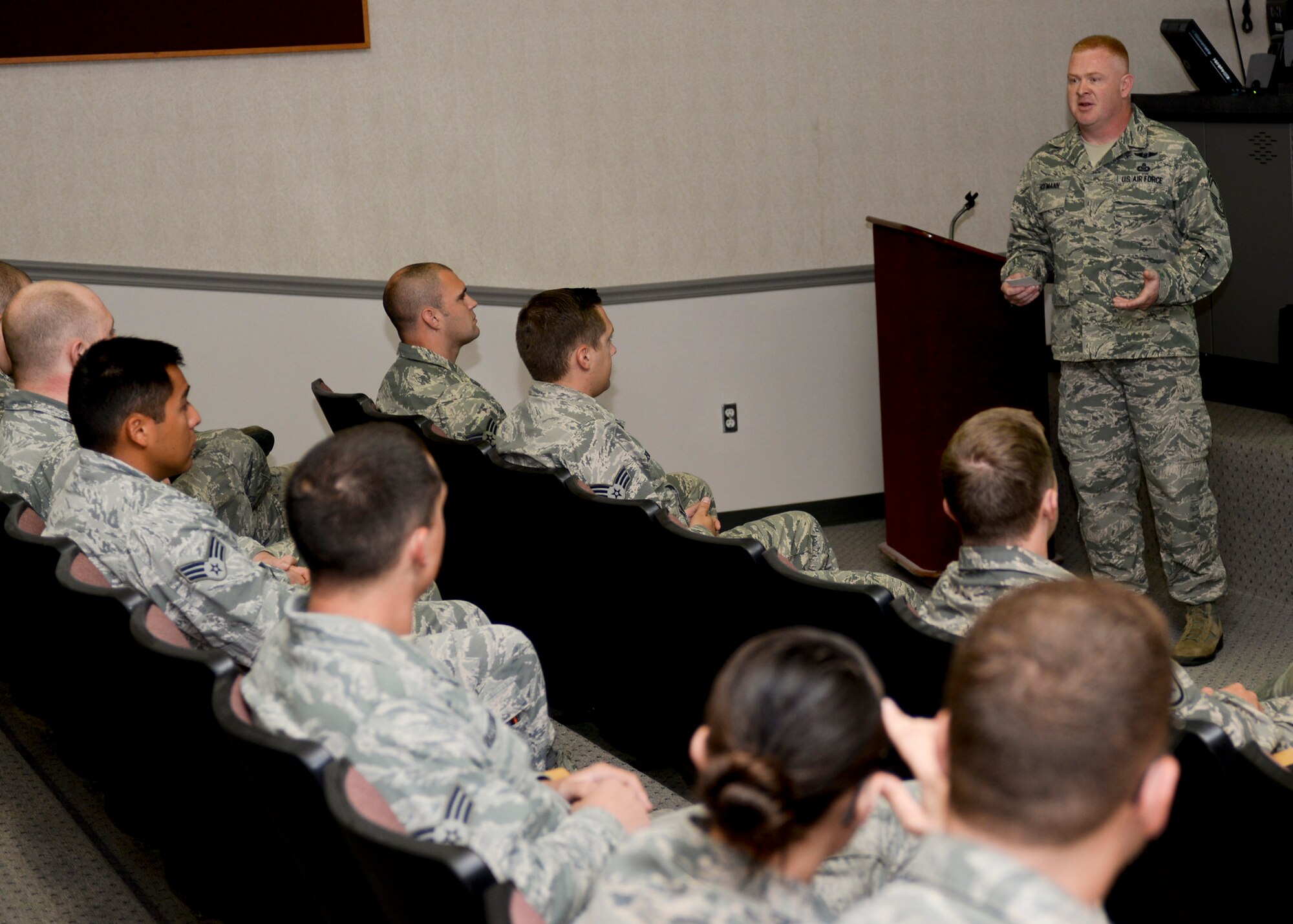 Chief Master Sgt. Joseph Hofmann, 28th Operations Group superintendent, addresses a group of Airmen at Ellsworth Air Force Base, S.D., Aug. 27, 2015. As a chief, Hofmann is a key leader who brings substantial operational and occupational experience to his unit and Airmen. (U.S. Air Force photo by Senior Airman Anania Tekurio/Released)