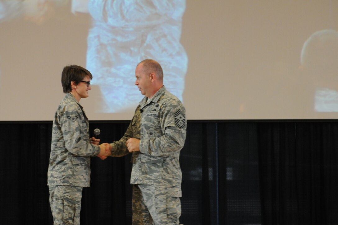 Airman 1st Class Madison Harrison, 161st Air Refueling Wing material management specialist,  talks on stage with Chief Master Sgt. James W. Hotaling, command chief master sergeant of the Air National Guard, at the 2015 ANG Enlisted Leadership Symposium, Camp Dawson, W. Va., Aug 17-19, 2015.  ELS is designed for enlisted Airmen of all ranks to get professional development that can be used to better enhance Airmen’s careers. (U.S. Air National Guard photo by Master Sgt. David Eichaker/released)