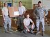 HORSHAM AIR GUARD STATION, Pa. – Airman 1st Class Anthony Frey, left, Master Sgt. Joseph Sommers, Airman 1st Class Igor Karlov and Senior Airman Anthony Natali, all from the 111st Logistics Readiness Squadron here, take a breather after unloading, accounting for and storing two 53-foot trailers of equipment destine to support vital wing missions, Aug. 27, 2015.

“It’s a tedious process,” said Sommers. “It’s a good thing we have a re-purposed building to accomplish a job like this. You just can't place 50 pallets of equipment anywhere, you need room to maneuver. You need space to work.” (U.S. Air National Guard photo by Master Sgt. Christopher Botzum/Released)
