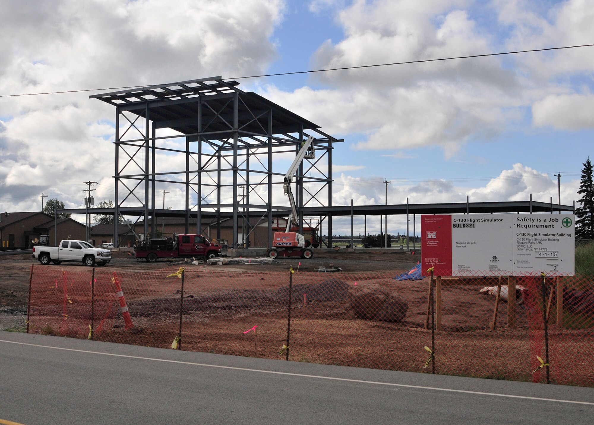 Progress! The C-130 Flight Simulator building is taking shape as construction workers attach metal sheets for the roof at the Niagara Falls Air Reserve Station N.Y. on August 27, 2015. (U.S. Air Force photo by Peter Borys)