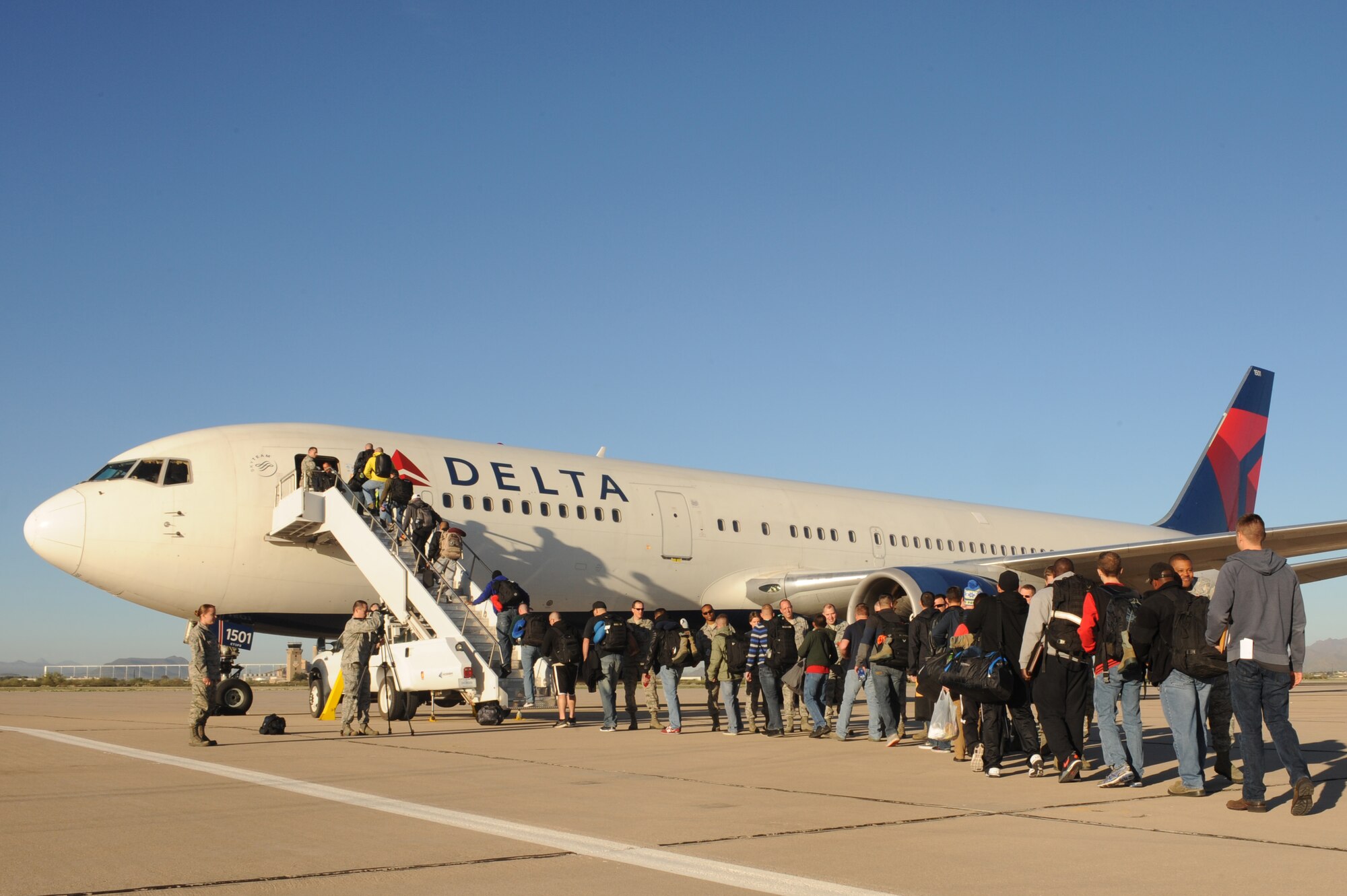 U.S. Air Force Airmen from the 355th Fighter Wing depart for a deployment from Davis-Monthan Air Force Base, Ariz., Feb. 11, 2015. These Airmen are a part of the largest deployment of personnel since WWII to deploy from D-M. (U.S. Air Force photo by Airmen 1st Class Cheyenne A. Powers/Released)