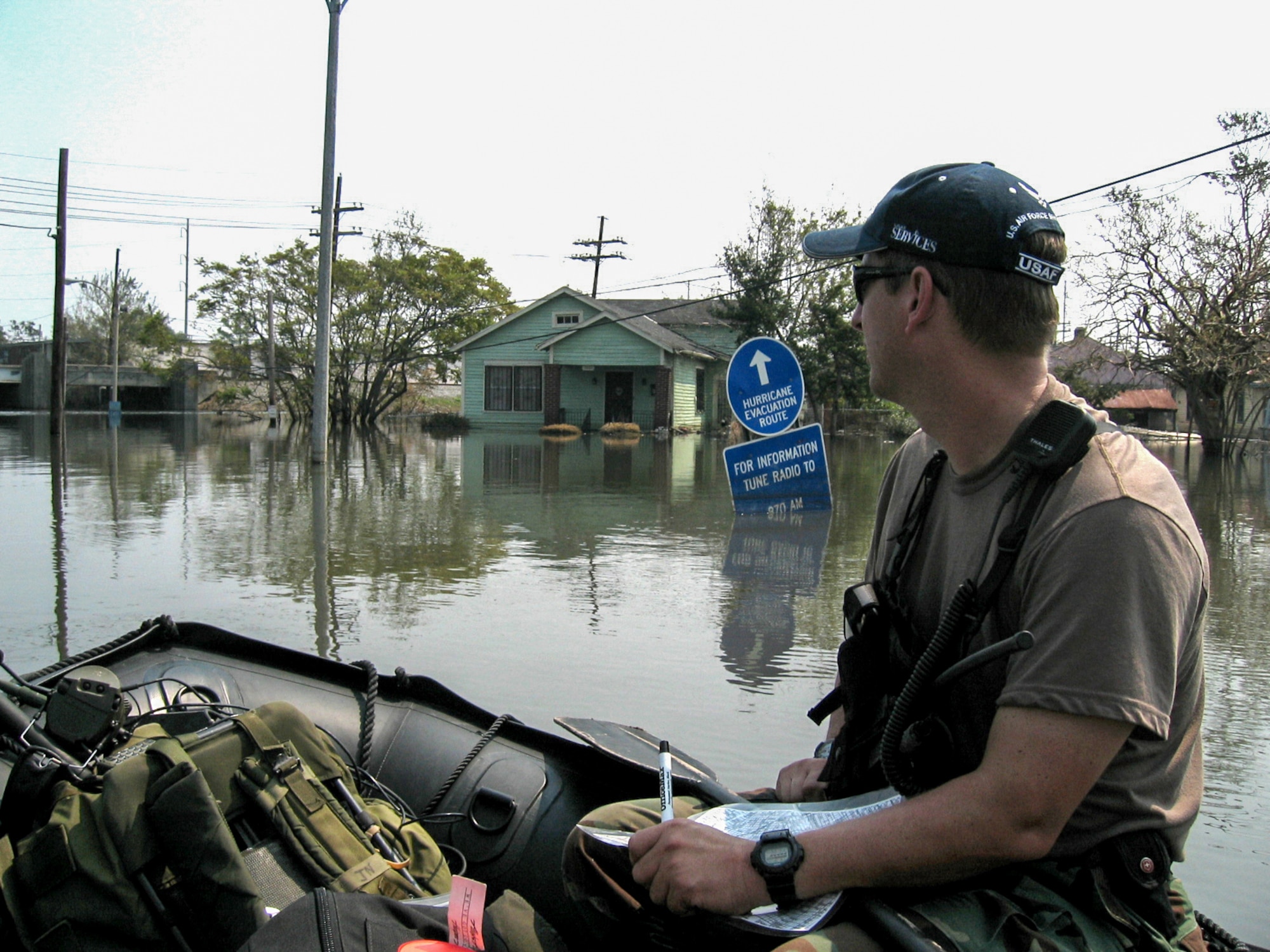 A Kentucky Air National Guard combat controller searches for stranded residents during a search-and-rescue mission in New Orleans following Hurricane Katrina Sept. 5, 2005. (U.S. Air National Guard photo)