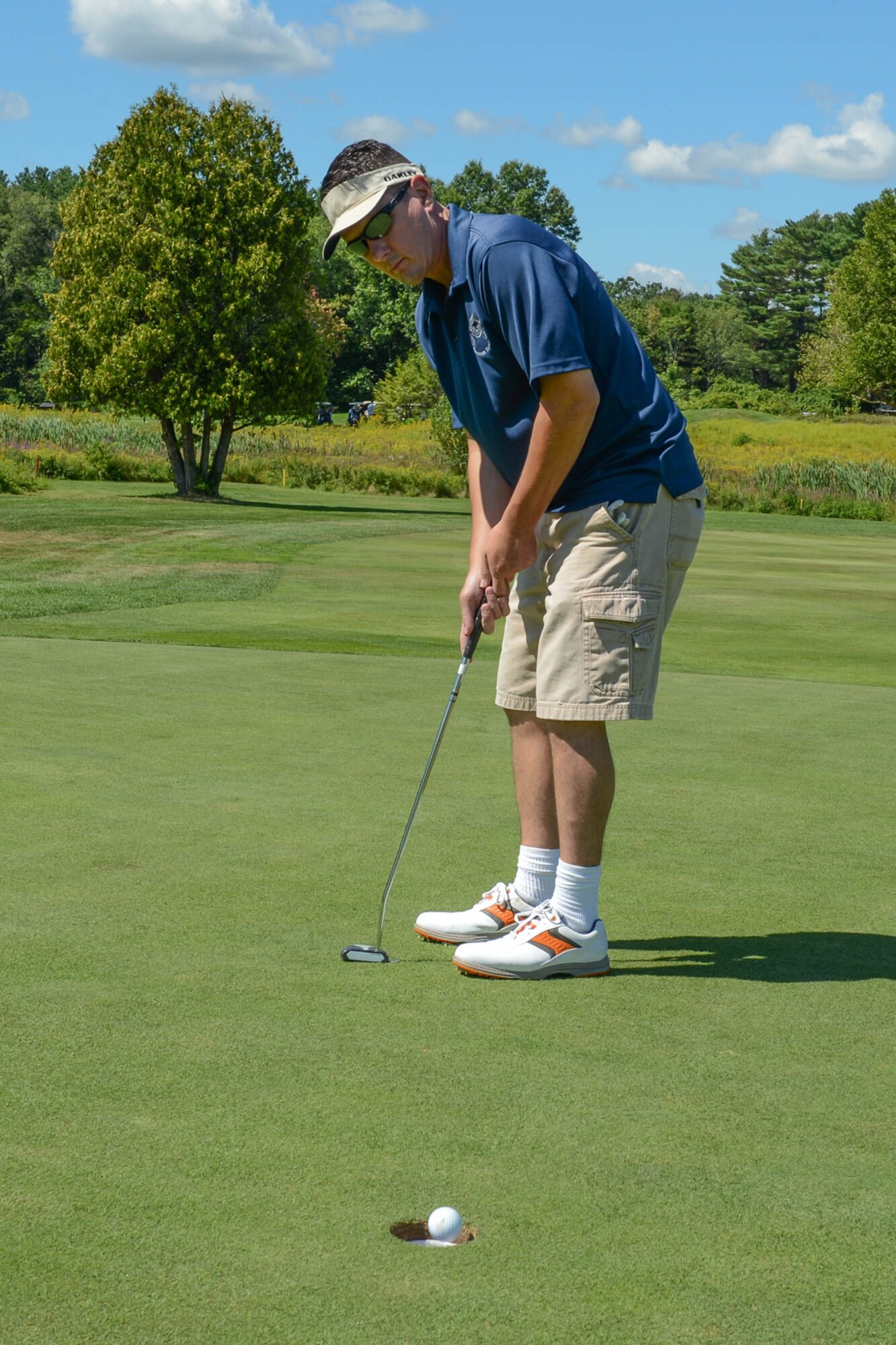 Senior Master Sgt. Shon Teicheira, 66th Force Support Squadron Family Readiness coordinator, watches the ball fall into the hole at the Patriot Golf Course Aug. 28. Teicheira and others participated in the annual Chief's Golf Tournament at the Hanscom course in Bedford, Mass. (U.S. Air Force photo by Jerry Saslav)