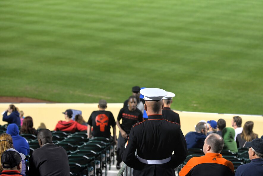 Members of the U.S. Marine Corps make their way to their seat during military appreciation night at the  Omaha Storm Chasers games at Werner Park in Papillion, Nebraska, Aug. 28.  The game between the Chasers and the Fresno Grizzlies was dedicated the local military members.  (U.S. Air Force photo by Josh Plueger/Released)