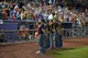 Member of the U.S. armed forces stand along the first base line and are recognized for their service during military appreciation night at Werner Park in Papillion, Nebraska, Aug. 28. Werner Park is home to the Omaha Strom Chasers, the Triple-A affiliate of the Kansas City Royals.  (U.S. Air Force photo by Josh Plueger/Released)