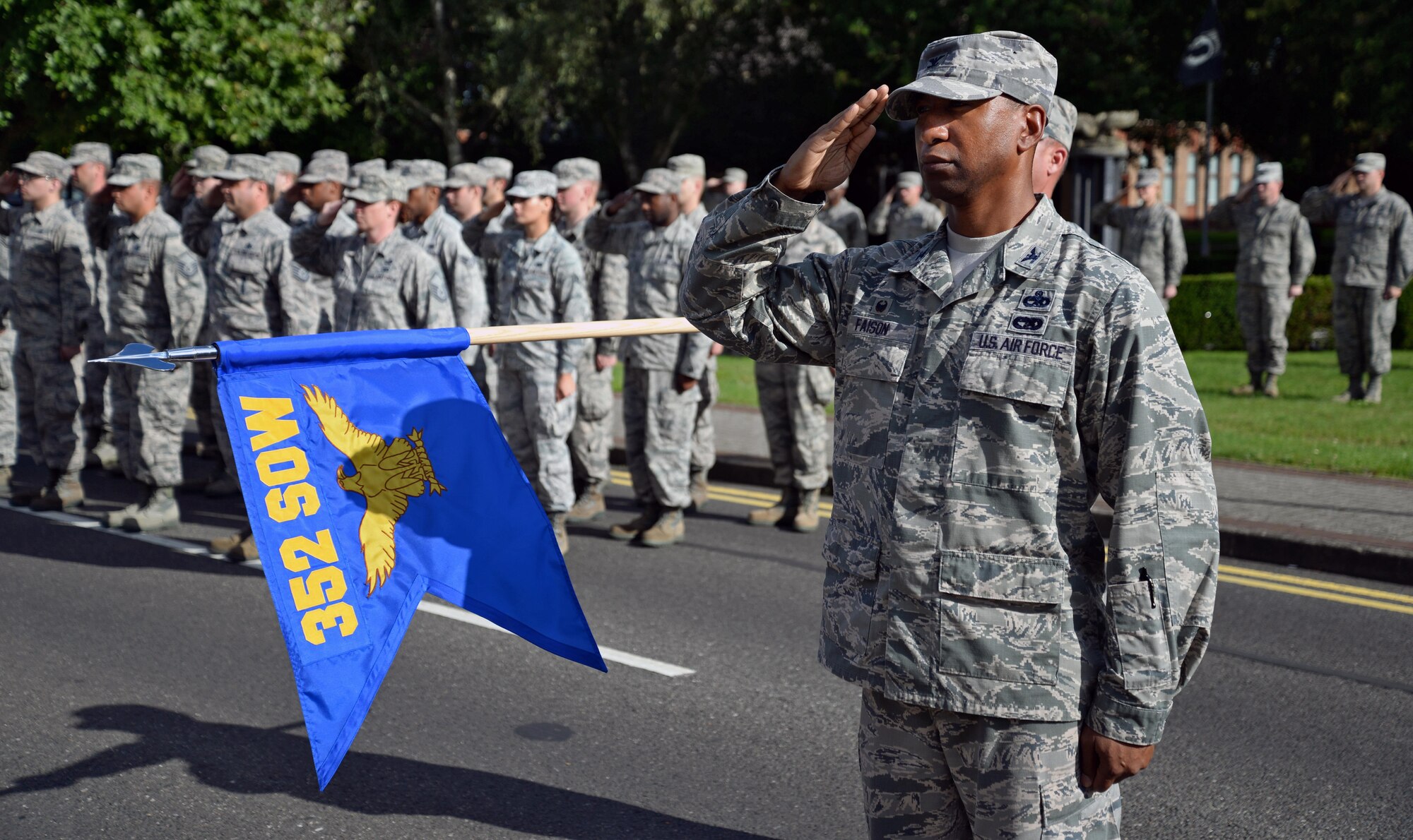 U.S. Air Force Col. Eric Faison, 352nd Special Operations Maintenance Group commander, pays respect to the flag during retreat Aug. 29, 2015, on RAF Mildenhall, England. A retreat ceremony, in which the U.S. flag and Royal Air Force ensign are retired, takes place on the last Friday of every month. This month’s retreat is to celebrate 2015’s Year of the Air Commando, marking the 25th anniversary of the activation of Air Force Special Operations Component and 35th anniversary of Operation EAGLE CLAW; the failed Iranian hostage rescue crisis. (U.S. Air Force photo by Senior Airman Christine Halan/Released) 