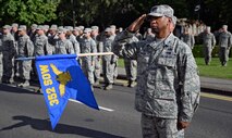 U.S. Air Force Col. Eric Faison, 352nd Special Operations Maintenance Group commander, pays respect to the flag during retreat Aug. 29, 2015, on RAF Mildenhall, England. A retreat ceremony, in which the U.S. flag and Royal Air Force ensign are retired, takes place on the last Friday of every month. This month’s retreat is to celebrate 2015’s Year of the Air Commando, marking the 25th anniversary of the activation of Air Force Special Operations Component and 35th anniversary of Operation EAGLE CLAW; the failed Iranian hostage rescue crisis. (U.S. Air Force photo by Senior Airman Christine Halan/Released) 
