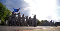 U.S. Air Force Air Commandos from the 352nd Special Operations Wing pay respect to the flag during retreat Aug. 28, 2015, on RAF Mildenhall, England. A retreat ceremony, in which the U.S. flag and Royal Air Force ensign are retired, takes place on the last Friday of every month. This month’s retreat is to celebrate 2015’s Year of the Air Commando. (U.S. Air Force photo by Senior Airman Christine Halan/Released)