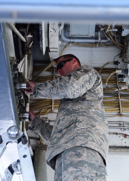 Staff Sgt. Eugene Healey, 28th Maintenance Group crew chief, inspects hoses inside a B-1 bomber loading bay during the Global Strike Challenge at Ellsworth Air Force Base S.D., Aug. 20, 2015. The competition is the world's premier bomber, Intercontinental Ballistic Missile and security force challenge between units from Air Force Global Strike Command, Air Combat Command, Air Force Materiel Command, Air Force Reserve Command and the Air National Guard. (U.S. Air Force photo by Airman 1st Class James L. Miller/Released)