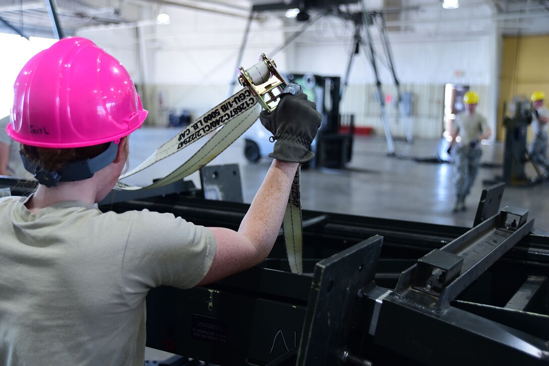 Senior Airman Julia Axtell, 28th Munitions Squadron line delivery crew member, prepares the ordnance assembly line for the munitions part of the Global Strike Challenge at Ellsworth Air Force Base S.D., Aug. 20, 2015. During the competition, teams showcase job proficiency and teamwork in a controlled environment. (U.S. Air Force photo by Airman 1st Class James L. Miller/Released)