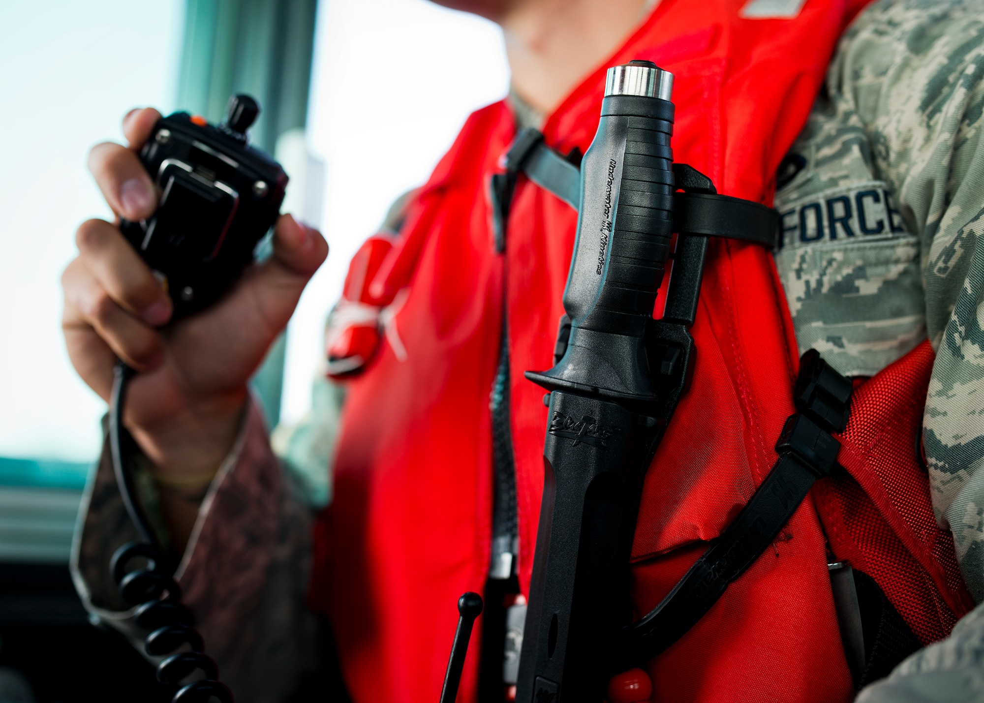 Senior Airman Nathan Koenig, 96th Security Forces Squadron, communicates via radio during a boat patrol around the base’s shoreline Aug. 25 at Eglin Air Force Base, Fla.  Recently, a group of defenders became qualified to operate the boat through Coast Guard certification.  They are responsible for monitoring and security of Eglin’s 153 miles of coastline.  (U.S. Air Force photo/Samuel King Jr.)
