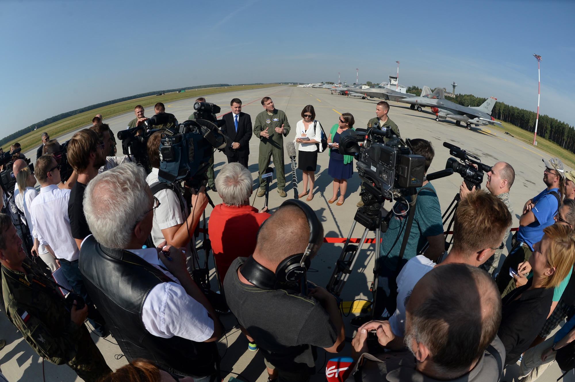 U.S. Air Force Maj. Gen. Christopher Bence, 3rd Air Force and 17th Expeditionary Air Force vice commander, speaks during a press conference on the flightline at Lask Air Base, Poland, Aug. 31, 2015. The general answered reporters' questions about the inaugural U.S. Air Force F-22 Raptor training deployment in Europe as part of the European Reassurance Initiative. The aircraft will conduct air training with other Europe-based aircraft and forward deploy from Spangdahlem Air Base, Germany, to maximize training opportunities while demonstrating the U.S. commitment to NATO allies and the security of Europe. (U.S. Air Force photo by Staff Sgt. Joe W. McFadden/Released)