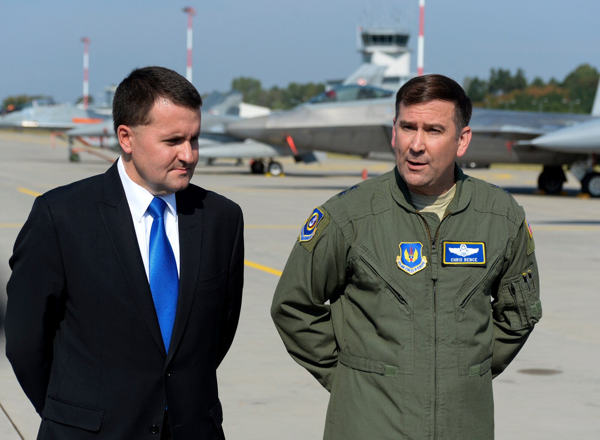 Robert Kupiecki, Polish Deputy Minister of National Defence, left, and U.S. Air Force Maj. Gen. Christopher Bence, 3rd Air Force and 17th Expeditionary Air Force vice commander, right, speak during a press conference on the flightline at Lask Air Base, Poland, Aug. 31, 2015. The two highlighted the U.S. Air Force F-22 Raptor training deployment to Europe as part of the European Reassurance Initiative. The deployment is also part of ensuring 5th generation fighters can deploy to European bases and other NATO installations. The F-22s are deployed from the 95th Fighter Squadron at Tyndall Air Force Base, Florida. (U.S. Air Force photo by Staff Sgt. Joe W. McFadden/Released)