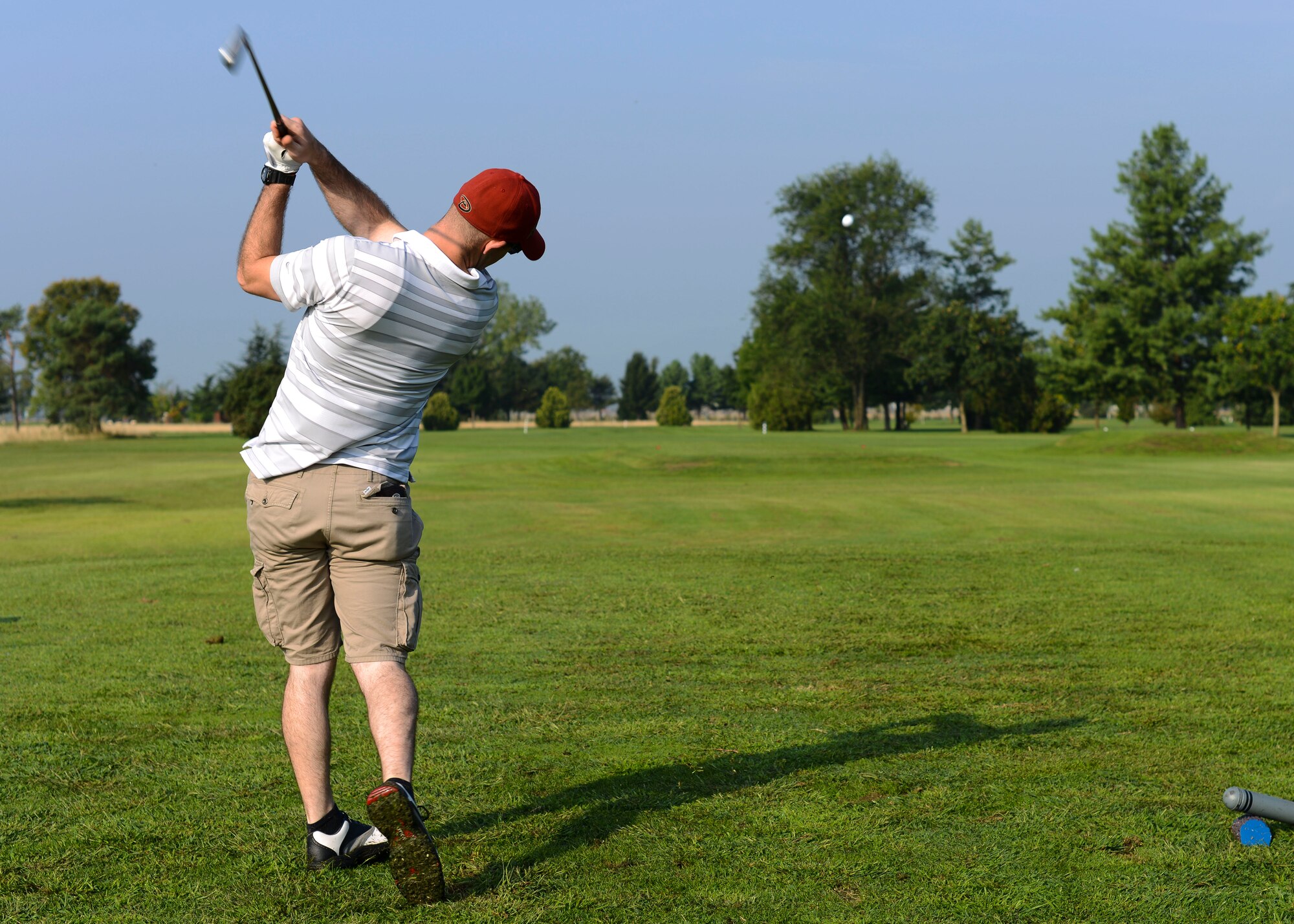 U.S. Air Force Airman 1st Class Javen Manning, 31st Civil Engineer Squadron power production technician, tees off during the annual Adam K. Ginett EOD Warrior Foundation Golf Tournament and Auction, Aug. 28, 2015, at Aviano Air Base, Italy. The more than $12,000 from the tournament, auction and raffles went to the EOD Warrior Foundation. (U.S. Air Force photo by Senior Airman Austin Harvill/Released)